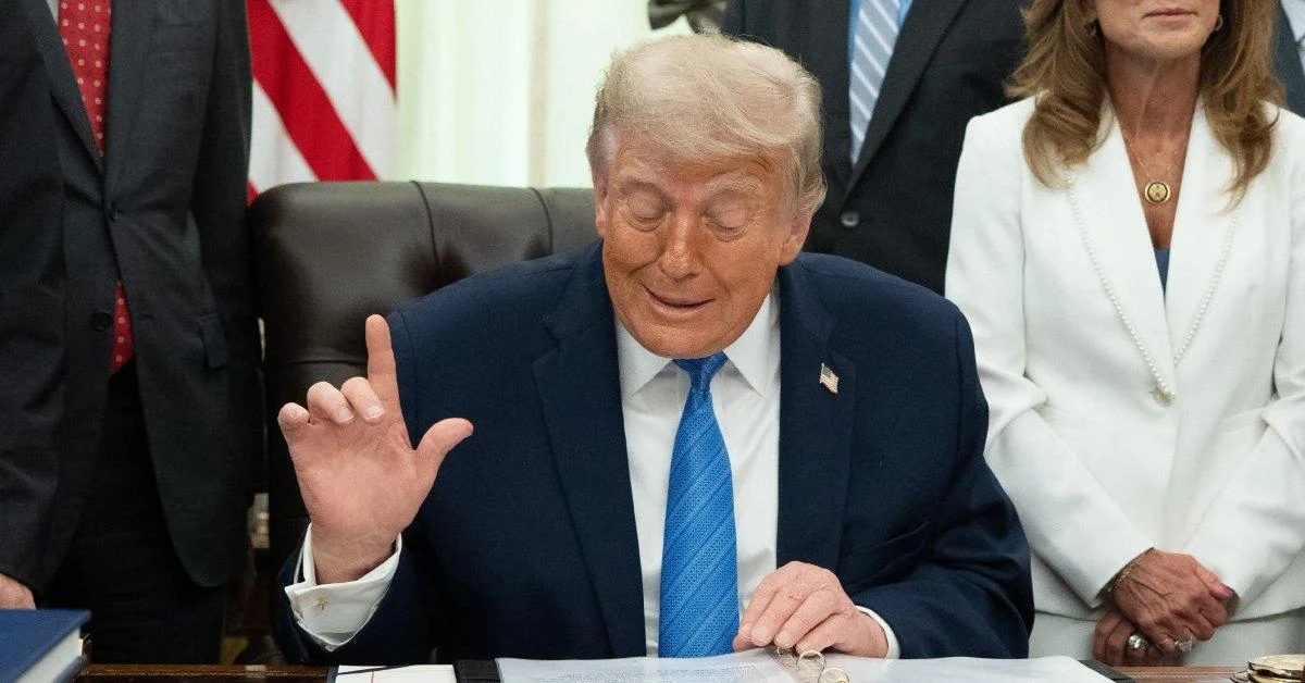 Donald Trump sitting in the Oval Office.